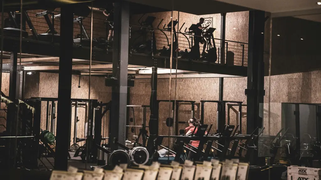 A gym floor lined with weight machines and free weights