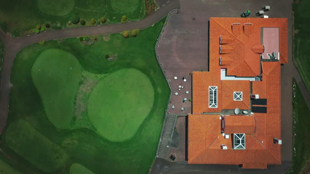 An aerial view looking straight down on a clubhouse and its grounds