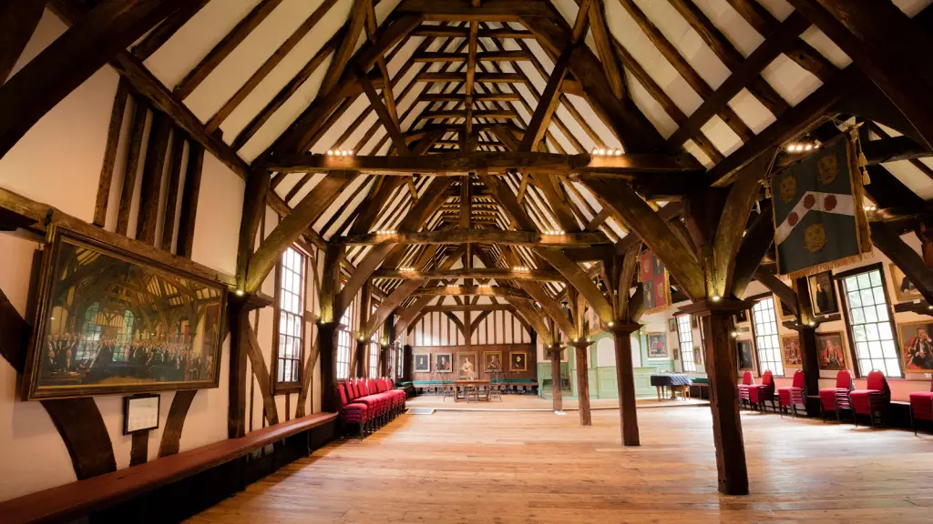 The interior of a timber-framed village hall with a vaulted beamed ceiling